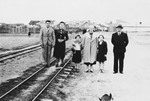 Members of the extended Kleinhandler family pose on a train track at the railroad station in Chmielnik, Poland.