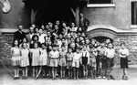 Group portrait of Jewish children in front of the OSE Home in Draveil.