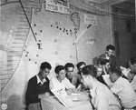 Jewish DPs study in the reading room of a vocational training school supported by the American Joint Distribution Committee.