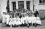 Group portrait of the staff and patients of a hospital and convalescent home for concentration camp survivors in Sweden.