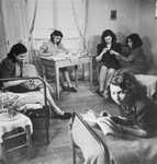 Young Jewish women living at the Le Tremplin children's home, relax in their room.