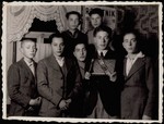 Fishke Shlanski receives an album with the pictures of his friends prior to his immigration to America.