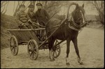 A Levin, an Eishyshkian coachman, steers a horse-drawn wagon accompanied by two friends.