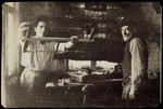 Gedalia Cofnas and his son, Pessah, work in their carpentry shop.