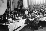 Group portrait of members of a hachshara, a Zionist youth collective, at a banquet in Katowice.