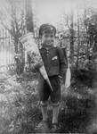 Portrait of the donor's brother, Siegbert Einstein on his first day of school, holding the traditional Schultüte [school cone] filled with candies.