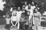 Janusz Korczak and Sabina Lejzerowicz pose with children and staff members at the Rozyczka farm, a summer retreat for the children who reside at the Krochmalna Street orphanage in Warsaw.