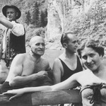 Samuel File, a Jewish businessman from Bielsko-Biala, Poland, relaxes outside on the banks of a river with his wife and friends during a summer vacation.