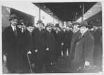 A delegation from the Soviet embassy waits at the train station in Rome to meet the new Soviet ambassador.