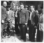 UNRRA camp director Harold Fishbein (center) poses with a group of Jewish DPs in the Schlachtensee displaced persons camp.