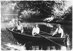 Three young Jewish women sit in a rowboat on a lake or river in Bad Homberg, Germany.