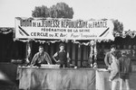 Benno Ginsburg helps man a booth at a gathering of the Union of Young Republicans of France, an umbrella organization of socialist and communist youth movements, including left-wing Zionists.