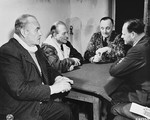 Former Luftflotte Commander Hugo Sperrle, former Chief of General Staff Heinz Guderian, former Air Force General Hans Jurgen Stumpff, and former Air Force Field Marshall Erhard Milch play cards until they are called to be witnesses at the International Military Tribunal trial of war criminals at Nuremberg.