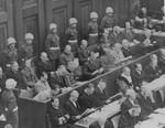 The defendants and their lawyers hear the reading of an indictment on the first day of the International Military Tribunal of war criminals at Nuremberg.