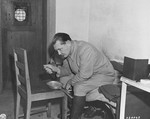 Hermann Goering eats breakfast in his cell while awaiting the opening of the day's court proceedings at the International Military Tribunal trial of war criminals at Nuremberg.