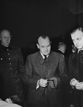 Defendants Alfred Jodl, Hans Frank, and Alfred Rosenberg during a recess at the International Military Tribunal trial of war criminals at Nuremberg.