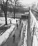 Prisoners and American guards on the exercise grounds at the Nuremberg prison, where the major war criminals were interned during the International Military Tribunal trial.