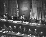 Tribunal members Lord Justice Geoffrey Lawrence (Britain, left) and Francis Biddle (U.S., right) confer at the opening session of the International Military Tribunal trial of war criminals at Nuremberg.