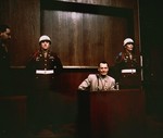 Hermann Goering testifies from the witness box at the International Military Tribunal trial of war criminals at Nuremberg.