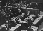 The defendants (left), their lawyers (middle), and interpreters (top) at the International Military Tribunal trial of war criminals at Nuremberg.