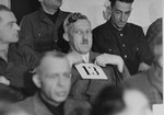 August Eigruber, former Gauleiter of Upper Austria and a defendant at the trial of 61 former camp personnel and prisoners from Mauthausen, sits in his place in the defendants' dock.