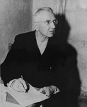 Defendant Hjalmar Schacht, the former Reichsminister for Economics, in his prison cell at the International Military Tribunal trial of war criminals at Nuremberg.