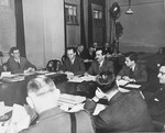 A.N. Trainin (center with mustache), head of the Soviet delegation to the War Crimes Executive Committee, speaks to his colleagues.