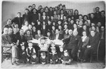 Yiddish actress Ida Kaminska visits the children and staff of a children's home in Chorzow, Poland.