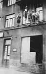 The bodies of five civilians executed by German forces hang from the balcony of a building in an unidentified city.
