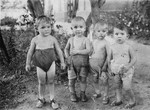 Portrait of four young children in a Soviet children's home in the Ukraine.