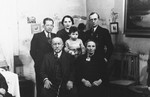 A Polish-Jewish family poses for a group portrait in their home.