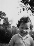 Close-up portrait of a young Jewish child in hiding.