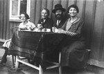 A Jewish family in Pilzno sits outside and enjoys a cup of coffee shortly before the start of the war.