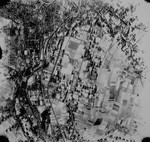 An aerial reconnaissance photograph of the Auschwitz concentration camp showing Auschwitz I under heavy snow cover.