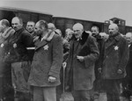 Jewish men from Subcarpathian Rus await selection on the ramp at Auschwitz-Birkenau.