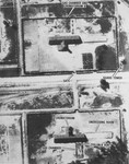 An aerial reconnaissance photograph of Auschwitz II (Birkenau) showing crematoria IV and V, gas chambers and undressing rooms.