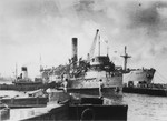View of the battered illegal immigrant ship, Exodus 1947, docked in the port of Haifa alongside the British "comfort ship," Ocean Vigour, to which the Exodus passengers are being transferred.