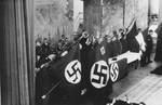 Nazi party officials give the Hitler salute at a gathering in the Stadthalle in Bad Blankenburg.