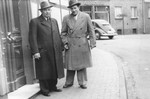 Two Jewish DPs from Oswiecim, Poland pose on a street in Celle, Germany.