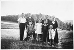 The Tichauer family poses for a family photo in the German countryside.