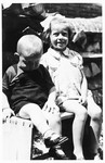 Two young Jewish children who survived the war in hiding, sit on a park bench in Ludbreg, Croatia.
