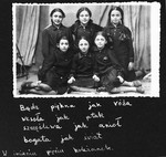 Group portrait of five classmates from the Tarbut school in Luck in their school uniforms.