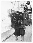 Sara Sztejnsznajd waits with her aunt Peppa Garber in front of the ship, The Batory, prior to her departure for America.