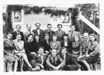Jewish DPs gather in front of a sign celebrating the Hebrew Tarbut school in the Foehrenwald displaced persons camp.