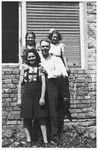 Ljudevit (Ludva) Vrancic poses outside with his three Jewish nieces.