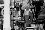 Engineer Sol Lester oils the machinery in the engine room of the President Warfield after the gale that nearly sank the ship during its first attempt to cross the Atlantic Ocean.