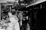 Cooks (Arras and Russell) prepare a meal in the galley of the President Warfield/Exodus 1947.
