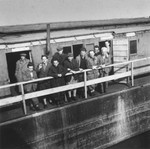 Jewish refugees who are members of the Kladova transport, stand on the deck of a barge in the port of Kladova.
