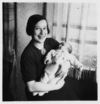 Irmgard Koeppel holds her newborn baby daughter Judith in her arms.