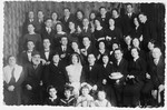 A large Jewish family from Brest  poses for a group wedding portrait.